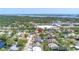 Aerial view of a residential neighborhood with mature trees, showcasing the home's location near the water at 8130 129Th N Ln, Seminole, FL 33776