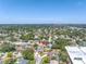 An aerial view of home, surrounded by mature trees, within the community. Close to shopping and the city at 8130 129Th N Ln, Seminole, FL 33776