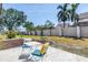 Charming backyard patio with comfortable seating and a well-maintained lawn at 8130 129Th N Ln, Seminole, FL 33776