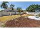 Fenced backyard featuring mature landscaping and patio seating area at 8130 129Th N Ln, Seminole, FL 33776