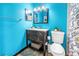 Charming bathroom with wood-look flooring, modern vanity and fixtures at 8130 129Th N Ln, Seminole, FL 33776