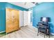 Bright bedroom featuring light wood floors, closet and an accent wall at 8130 129Th N Ln, Seminole, FL 33776