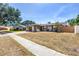 Charming single-story home with a well-maintained lawn, attached garage, and inviting curb appeal at 8130 129Th N Ln, Seminole, FL 33776