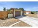 Close-up of garage featuring a private driveway, and some landscaping at 8130 129Th N Ln, Seminole, FL 33776