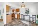 Bright kitchen featuring stainless steel appliances, wood cabinets, tile flooring, and adjacent dining space at 8130 129Th N Ln, Seminole, FL 33776