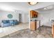Open-concept living room and kitchen area, featuring tile and wood flooring at 8130 129Th N Ln, Seminole, FL 33776