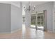 Light-filled dining area with tile floors and sliding door access to the outside patio at 8408 Nuzum Rd, Brooksville, FL 34613