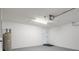 Clean garage interior with water heater on gray epoxy flooring at 8408 Nuzum Rd, Brooksville, FL 34613
