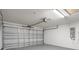 Spacious two-car garage with gray epoxy flooring and an electrical panel at 8408 Nuzum Rd, Brooksville, FL 34613