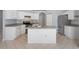 Modern kitchen with white cabinets, granite countertops, a center island, and stainless steel appliances at 8408 Nuzum Rd, Brooksville, FL 34613