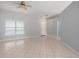 Neutral living area with tile flooring and a ceiling fan at 8408 Nuzum Rd, Brooksville, FL 34613