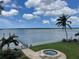 Beautiful backyard featuring a spa, lush landscaping, private dock, and stunning water views at 8488 35Th N Ave, St Petersburg, FL 33710