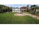 Lush backyard with a stone hot tub, manicured lawn, and inviting outdoor space, ideal for relaxation and entertainment at 8488 35Th N Ave, St Petersburg, FL 33710