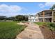 Stunning backyard showcasing a stone spa, lush lawn, and meticulously designed outdoor space, perfect for relaxation and entertaining at 8488 35Th N Ave, St Petersburg, FL 33710