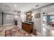 Spacious bathroom featuring dual vanities, a decorative rug, and an open doorway with water views at 8488 35Th N Ave, St Petersburg, FL 33710