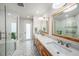 Spacious bathroom featuring dual sinks, and glass shower at 8488 35Th N Ave, St Petersburg, FL 33710