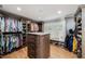 Walk-in closet features custom shelving, center island, and window at 8488 35Th N Ave, St Petersburg, FL 33710