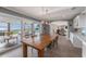 Bright dining area showcasing seamless access to the outdoor living space with scenic water views at 8488 35Th N Ave, St Petersburg, FL 33710
