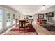 Open-concept dining area with seamless flow to living room and outdoor pool at 8488 35Th N Ave, St Petersburg, FL 33710