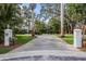 Wide driveway approaching a large, inviting home with lush greenery offering ample parking and curb appeal at 8488 35Th N Ave, St Petersburg, FL 33710