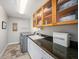 Functional laundry room with ample storage, granite countertops, and modern appliances at 8488 35Th N Ave, St Petersburg, FL 33710