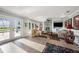 Inviting living room with fireplace and access to the pool area, perfect for entertaining at 8488 35Th N Ave, St Petersburg, FL 33710