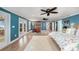 Large main bedroom with hardwood floors, area rug, and access to patio at 8488 35Th N Ave, St Petersburg, FL 33710