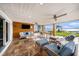 Relaxing covered patio with TV, comfortable seating, and waterfront views at 8488 35Th N Ave, St Petersburg, FL 33710