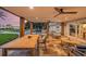 Covered patio with ample seating, ceiling fans, and stunning views of the manicured lawn, offering the ultimate outdoor comfort at 8488 35Th N Ave, St Petersburg, FL 33710