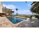 Backyard pool area with a waterfront view and lounge chairs at 8488 35Th N Ave, St Petersburg, FL 33710