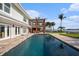 Stunning pool area featuring lush landscaping, waterfront views, and a spacious patio, creating an inviting outdoor oasis at 8488 35Th N Ave, St Petersburg, FL 33710