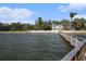 This waterfront home has a lovely dock for easy access to the water and relaxation by the water at 8488 35Th N Ave, St Petersburg, FL 33710
