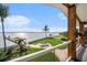 Backyard with waterfront view, featuring a private dock and relaxing lounge area at 8488 35Th N Ave, St Petersburg, FL 33710