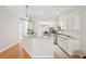 Open kitchen with granite counters, stainless steel appliances, and white cabinets, great for cooking at 10260 Devonshire Lake Dr, Tampa, FL 33647