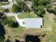 This aerial view displays the expansive lot and mature landscaping surrounding the home at 1033 Hammock Cir, Tarpon Springs, FL 34688