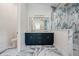 Bathroom features double vanities, large mirror, tile flooring, and glass shower at 1033 Hammock Cir, Tarpon Springs, FL 34688