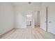 Bright bedroom features light wood floors and a ensuite bathroom and a closet at 1033 Hammock Cir, Tarpon Springs, FL 34688