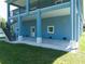 This home has a covered patio perfect for relaxing or entertaining outdoors at 1033 Hammock Cir, Tarpon Springs, FL 34688