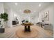 Bright foyer features wood floors, modern lighting, and neutral colors, creating a welcoming entrance at 1033 Hammock Cir, Tarpon Springs, FL 34688