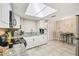 Bright kitchen featuring white cabinets, modern appliances, and ample counter space at 10817 Kingsbridge Rd, Port Richey, FL 34668