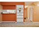 Open-concept living area with tile flooring and a view into the kitchen at 11536 Baywood Meadows Dr # 3, New Port Richey, FL 34654