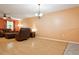 Spacious living room with hardwood floors, ceiling fan, and natural light at 11536 Baywood Meadows Dr # 3, New Port Richey, FL 34654