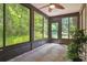 A screened-in patio offers additional living space with views of lush greenery at 11536 Baywood Meadows Dr # 3, New Port Richey, FL 34654