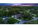 Aerial view of a beautiful neighborhood showcasing mature trees, lush lawns, and a well-maintained home at 11804 Carrollwood Village Cv, Tampa, FL 33618