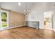 Elegant dining room with hardwood floors, a chandelier, and natural light from a large window at 11804 Carrollwood Village Cv, Tampa, FL 33618