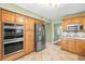 Well-appointed kitchen featuring stainless steel appliances, ample cabinet space, and granite countertops at 11804 Carrollwood Village Cv, Tampa, FL 33618