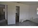 A bedroom needing repair showing plain walls and tile flooring at 119 18Th Nw St, Ruskin, FL 33570