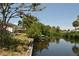 Waterfront views of trees and homes with a dock and boats ready to be used at 119 18Th Nw St, Ruskin, FL 33570