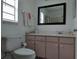 Bright bathroom with pink vanity and neutral walls at 12328 Shafton Rd, Spring Hill, FL 34608