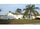 Charming single-story home with a well-maintained lawn and mature trees at 12328 Shafton Rd, Spring Hill, FL 34608